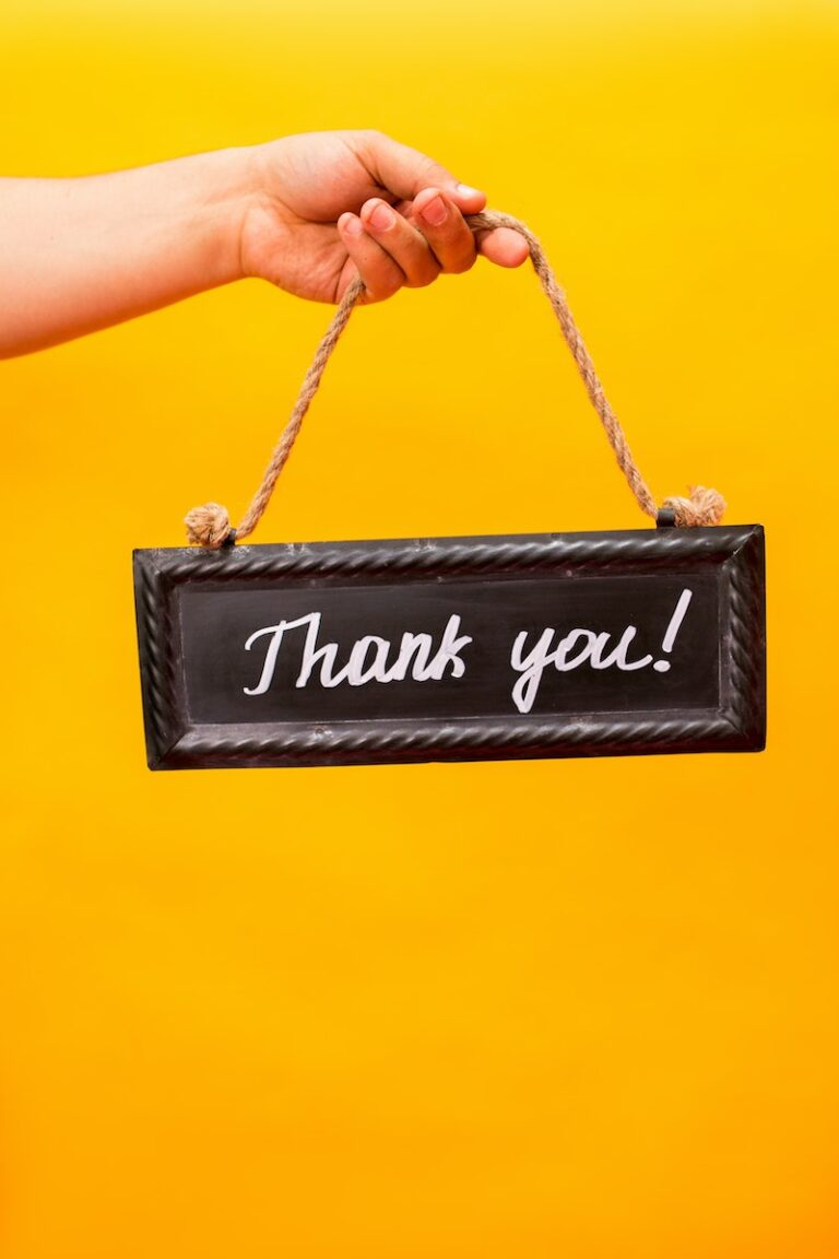 A Person Holding a Thank You Sign