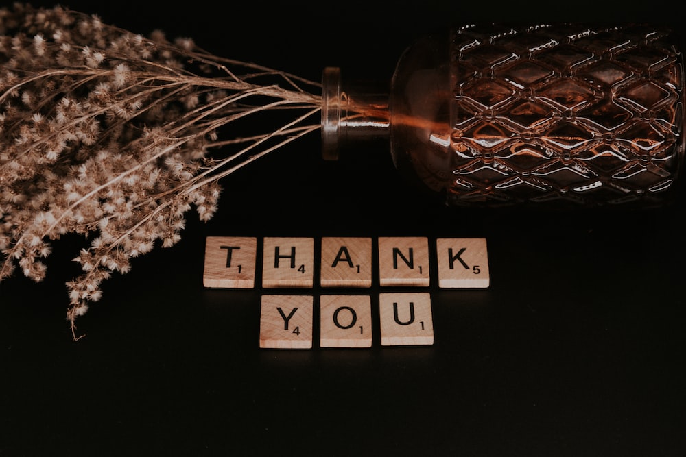 Clear glass bottle and Thank You pieces