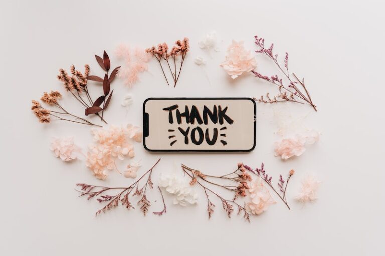 Dried Flowers and a Mobile Phone with Thank You Text