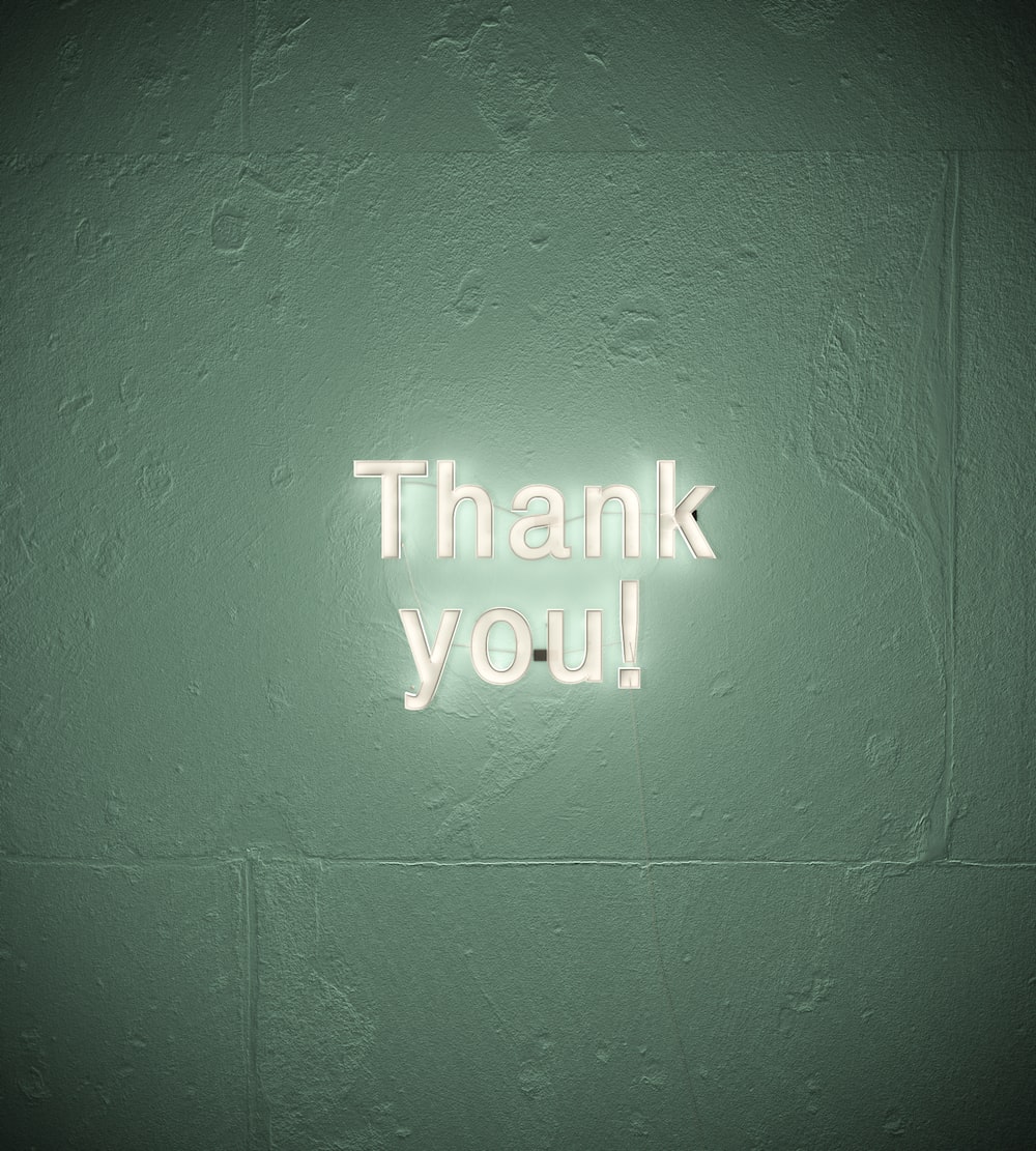 Green neon Thank You sign