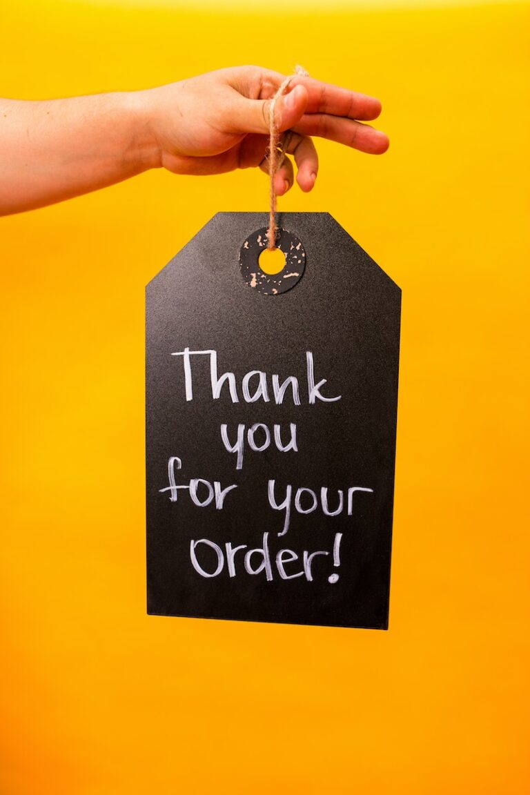 Person Holding Sign Thank You For Your Order