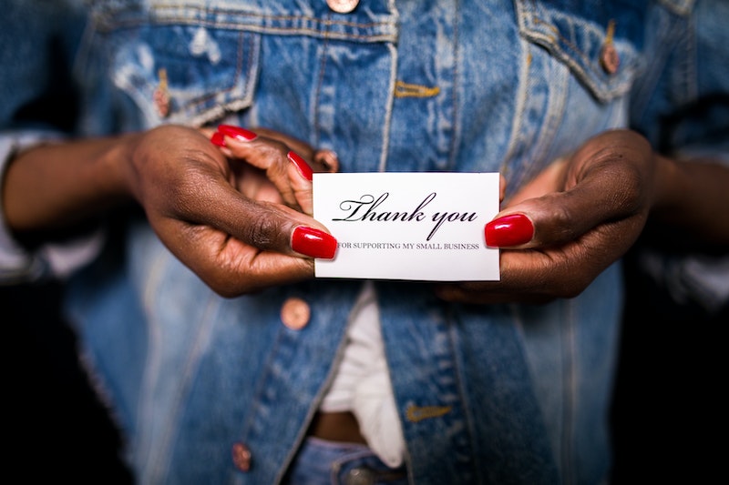 Person Holding Thank You Card