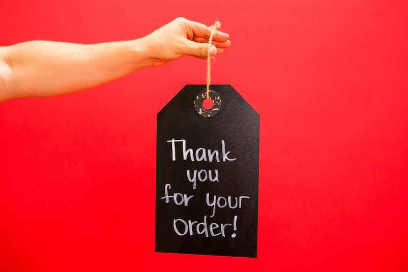Person Holding a Thank You Signage