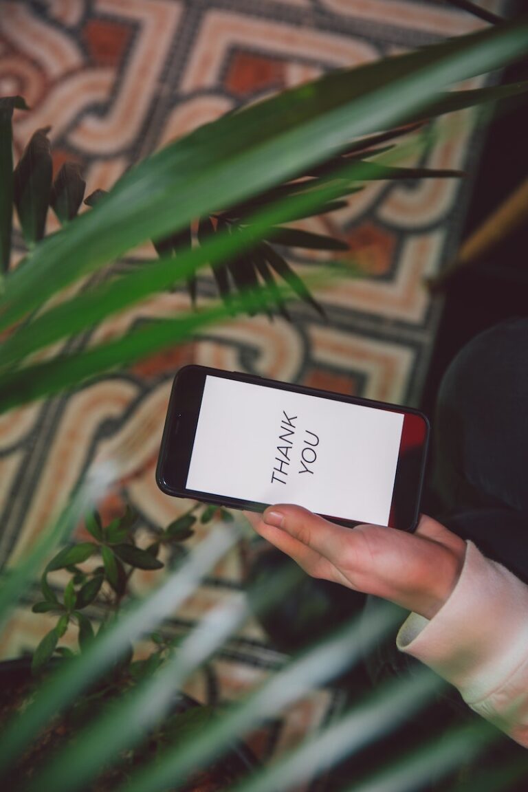 Photo Of Person Holding Black Smartphone