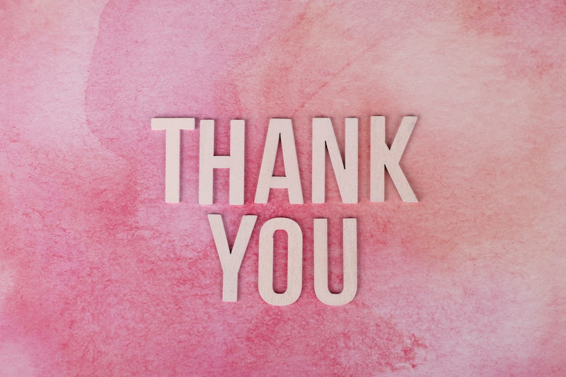 Thank You Text on Pink Surface