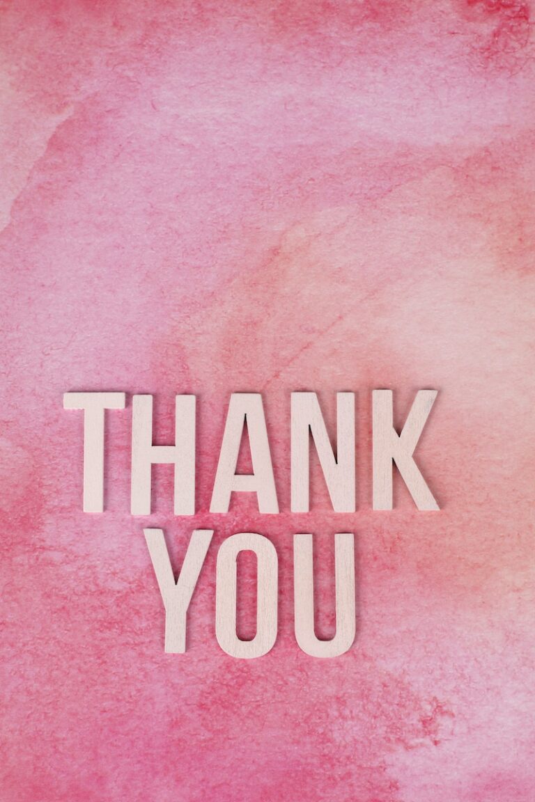 Thank You Text on a Pink Surface