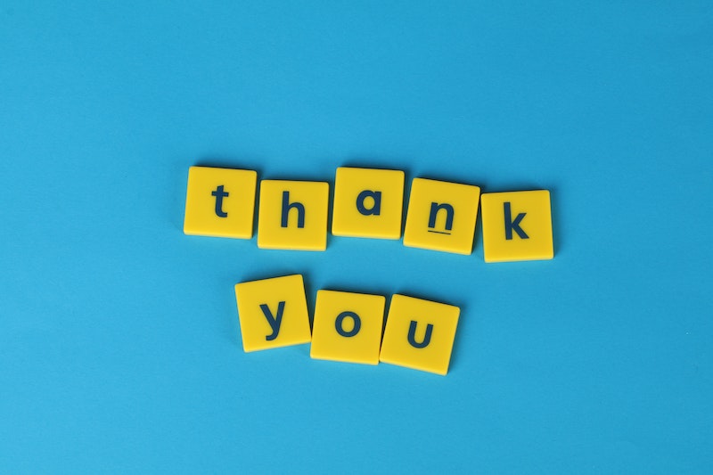Thank You Yellow Letter Tiles on Blue Background